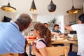 Multi-Generation Mixed Race Family Eating Meal Around Table At Home Together Royalty Free Stock Photo