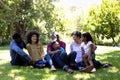 Multi-generation mixed race family enjoying their time at a garden Royalty Free Stock Photo