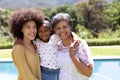Multi-generation mixed race family enjoying their time at a garden Royalty Free Stock Photo