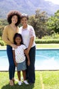 Multi-generation mixed race family enjoying their time at a garden Royalty Free Stock Photo