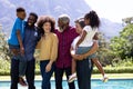 Multi-generation mixed race family enjoying their time at a garden Royalty Free Stock Photo