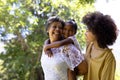 Multi-generation mixed race family enjoying their time at a garden Royalty Free Stock Photo