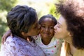 Multi-generation mixed race family enjoying their time at a garden Royalty Free Stock Photo