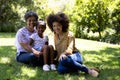 Multi-generation mixed race family enjoying their time at a garden Royalty Free Stock Photo