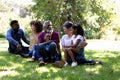 Multi-generation mixed race family enjoying their time at a garden Royalty Free Stock Photo