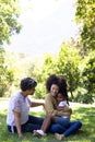 Multi-generation mixed race family enjoying their time at a garden Royalty Free Stock Photo