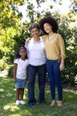 Multi-generation mixed race family enjoying their time at a garden Royalty Free Stock Photo
