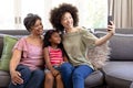 Multi-generation mixed-race family enjoying their time at home Royalty Free Stock Photo