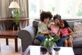 Multi-generation mixed-race family enjoying their time at home Royalty Free Stock Photo