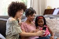 Multi-generation mixed-race family enjoying their time at home Royalty Free Stock Photo