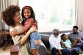 Multi-generation mixed-race family enjoying their time at home Royalty Free Stock Photo