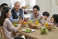 Multi generational asian family eating meal at home Royalty Free Stock Photo