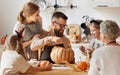 Multi generational family making jack o lantern