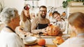 Multi generational family making jack o lantern