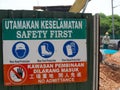 Multi-language Safety First Sign At Construction Site