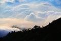 Multi layer of cloud behind mountain during sunset Royalty Free Stock Photo