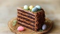 Multi-layered chocolate cake with pastel Easter eggs and cream frosting. Easter cake