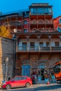 Tbilisi, Georgia, 17 December 2019 - multi level building of old town houses with carved balconies