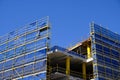 Scaffolding and Blue Safety Cladding on Construction Royalty Free Stock Photo