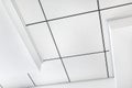 Multi level ceiling pattern with three dimensional protrusions and a suspended tiled ceiling. Royalty Free Stock Photo