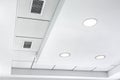 Multi-level ceiling with three-dimensional protrusions and a suspended tiled ceiling.