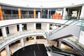 Multi-level modern light interior in a shopping center with an escalator. view from above Royalty Free Stock Photo