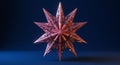 A multi-pointed star sculpture with sharp, symmetrical spikes is set against a deep Royalty Free Stock Photo