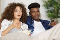 multi-racial couple engrossed in movie