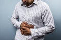 Multi racial man with constipation Royalty Free Stock Photo