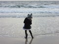 Multi Racial tween girl on beach by ocean Royalty Free Stock Photo