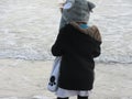 Multi Racial tween girl on beach by ocean Royalty Free Stock Photo