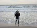 Multi Racial tween girl on beach by ocean Royalty Free Stock Photo