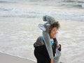 Multi Racial tween girl on beach by ocean Royalty Free Stock Photo