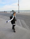 Multi Racial tween girl on boardwalk on beach Royalty Free Stock Photo