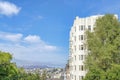 Multi-storey apartment building and a view of San Francisco neighborhood and mountain in California