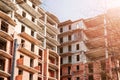 Multi-storey brick building under construction on Sunny summer day Royalty Free Stock Photo