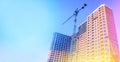 Multi-storey building under construction. Building. Unfinished house. Lifting crane. The concept of development. Royalty Free Stock Photo