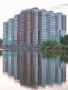 multi-storey house on the shore of the lake real and reflection