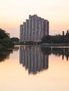 multi-storey house on the shore of the lake real and reflection evening