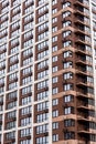 Multi storey modern new brown residential building close up Royalty Free Stock Photo