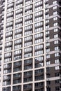 Multi storey modern new gray residential building close up Royalty Free Stock Photo