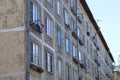 A multi-storey residential building of the Soviet period. Gray faceless windows and walls. Russia.