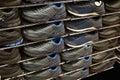 Multi-storey shelves with rows of man sneakers Royalty Free Stock Photo