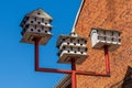 multi story bird houses on a post