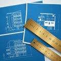 Multi story building with architectural renderings shown on blue Royalty Free Stock Photo