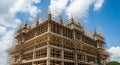 Multi-story Building Under Construction with Extensive Bamboo Scaffolding architecture skyscraper Royalty Free Stock Photo