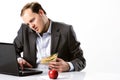 Multi tasking businessman works through lunch