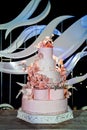 Multi-tiered wedding cake sugar flowers and birds Royalty Free Stock Photo