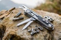 Multi-Tool Knife and Accessories on a Rock Royalty Free Stock Photo