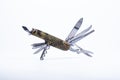 Multi-tool pocket folding with a camouflage pattern. Isolated with white background Royalty Free Stock Photo